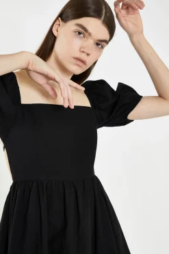 Glamorous Best Dressed Guest|Chic Escapes|Black Open-Back Babydoll Mini Dress -