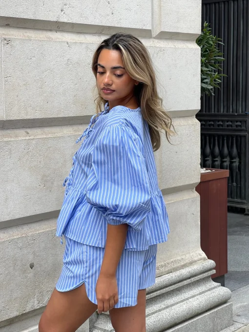 Glamorous Jet Setter|Chic Escapes|Blue-Stripe Tie-Front Peplum Top -